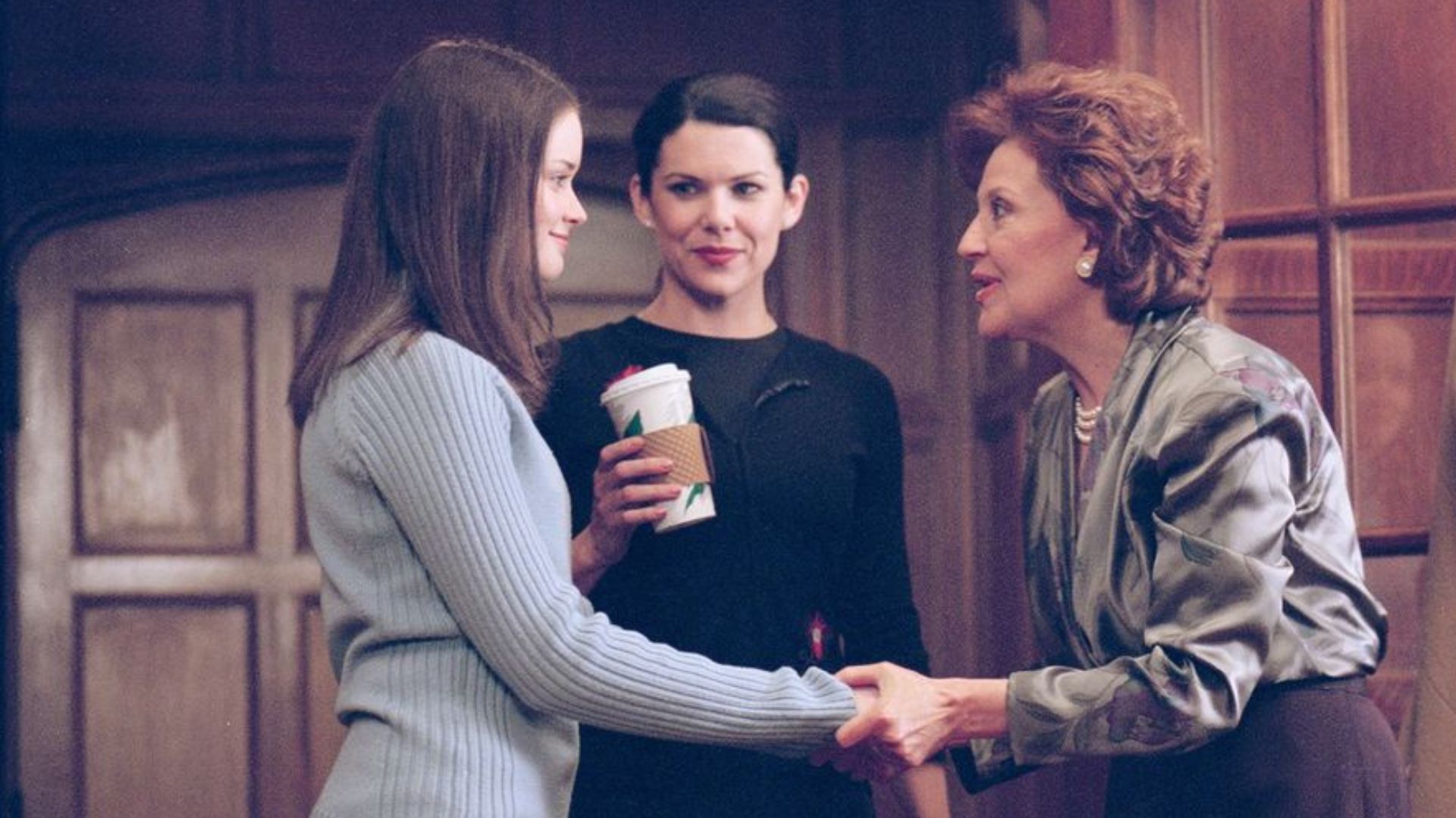 The Gilmore girls, Emily, Lorelei, and Rory, all gather during their Friday night dinner