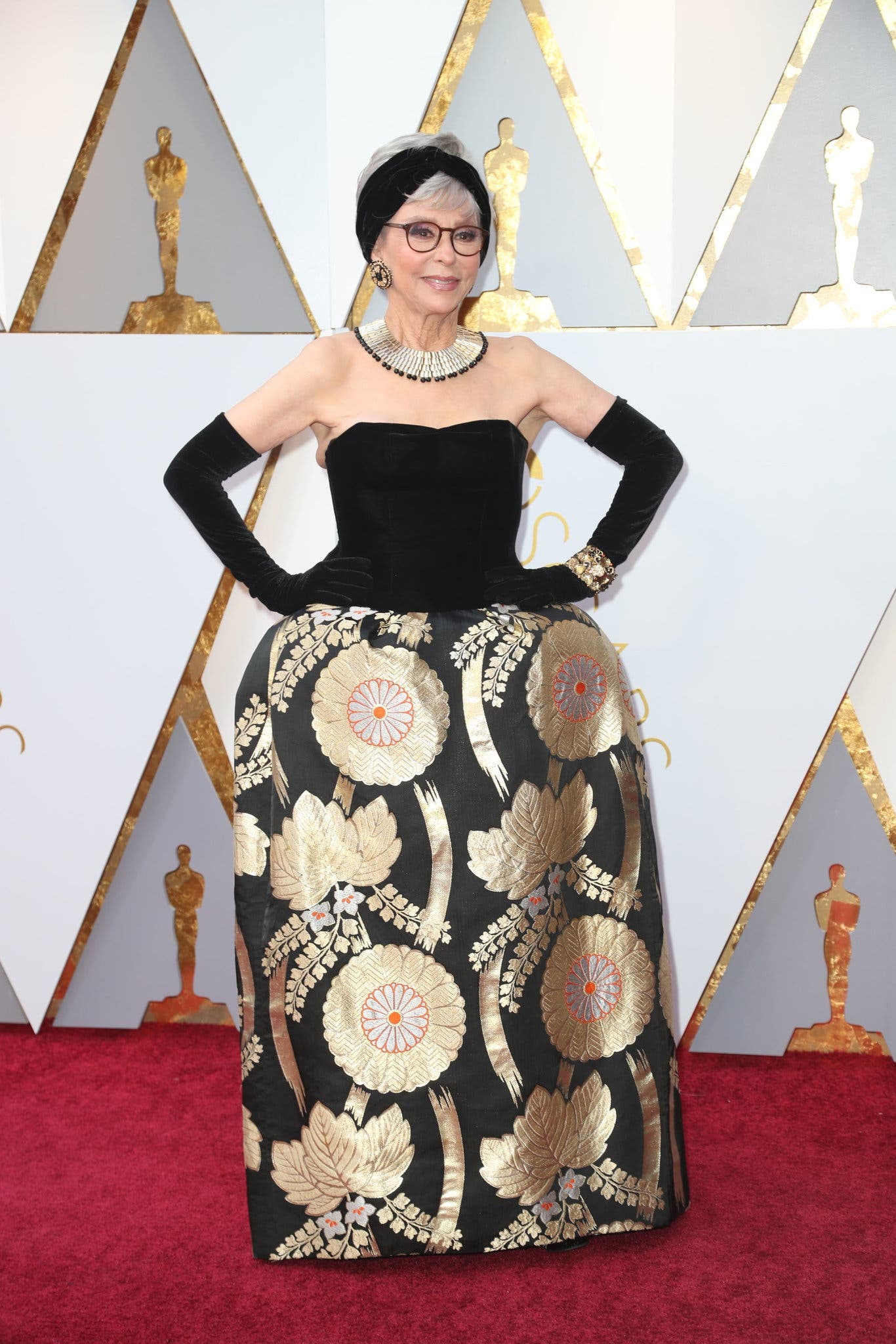 Rita Moreno at the 2018 Oscars wearing the same Pitoy Moreno gown she wore at the 1962 ceremony